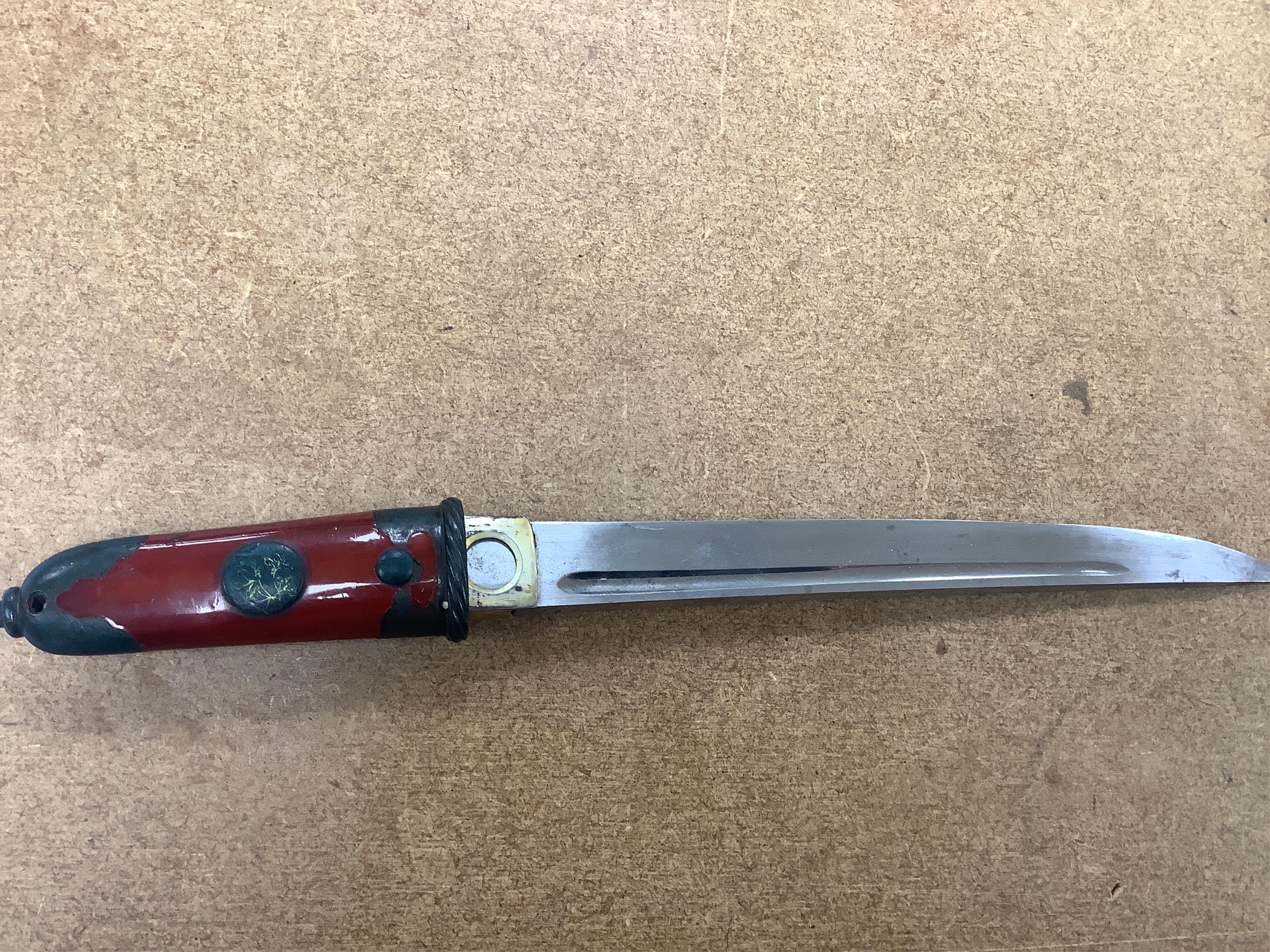 A Japanese knife in lacquered sheath and a handle, largest 34cm in length. Condition - fair to good